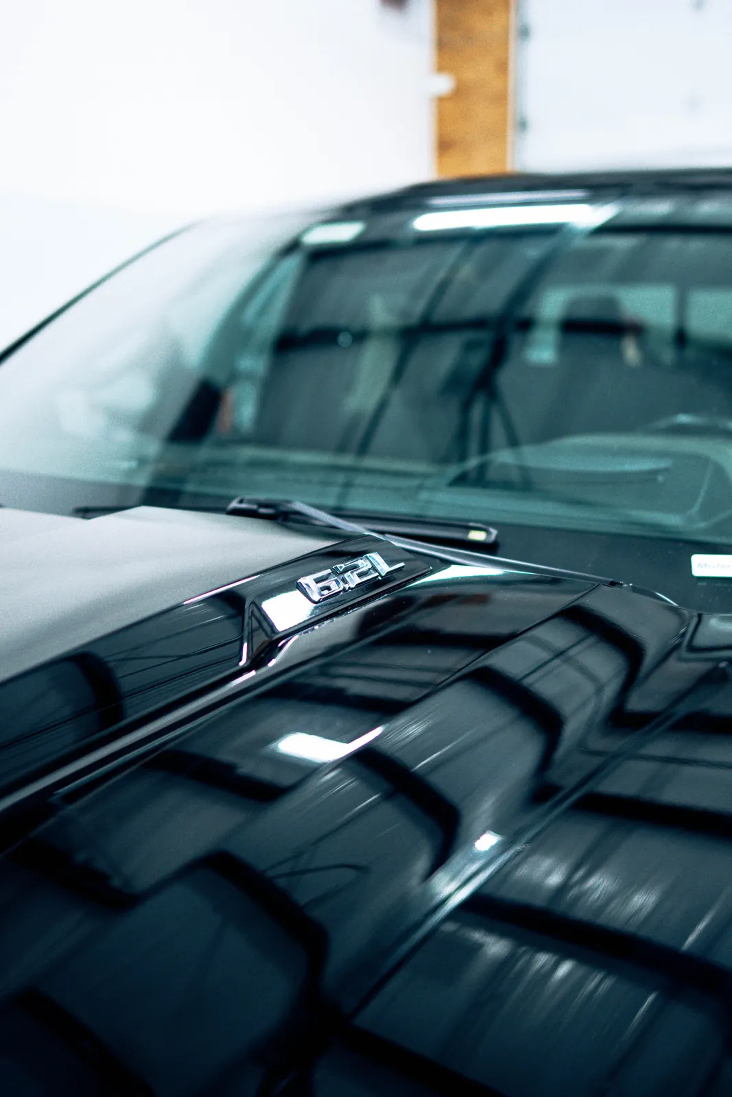 Deep gloss on a black panel ceramic coated at 719 Auto Customs