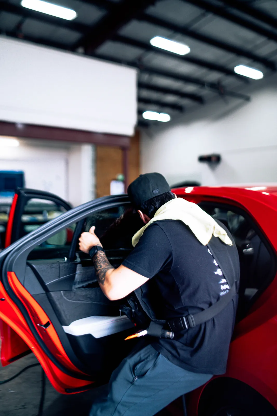 Window tint installed on a red sports car